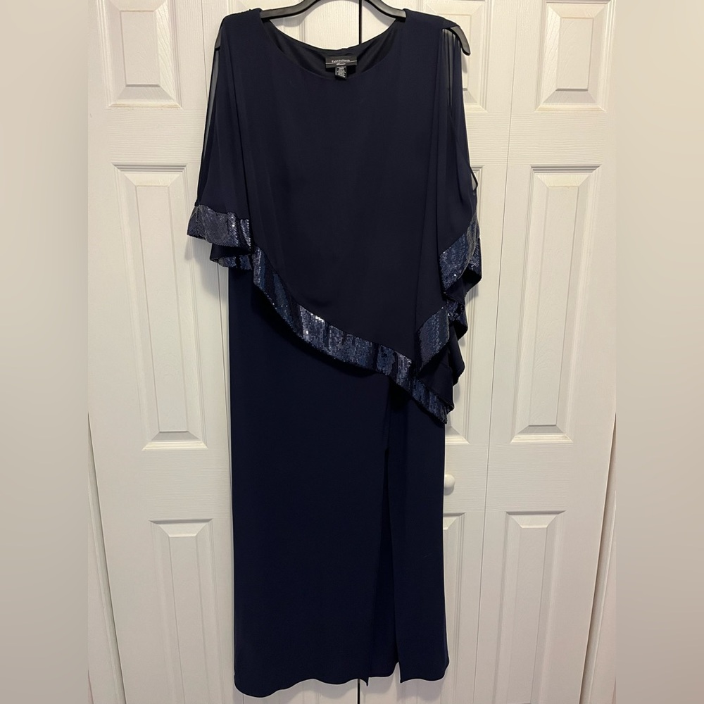 Long navy blue dress with cape overlay. Polyester chiffon with sequins.